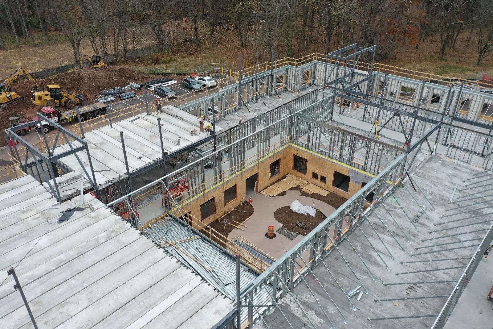 Precast plank erection in progress on a commercial project